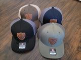 leather patch trucker hat